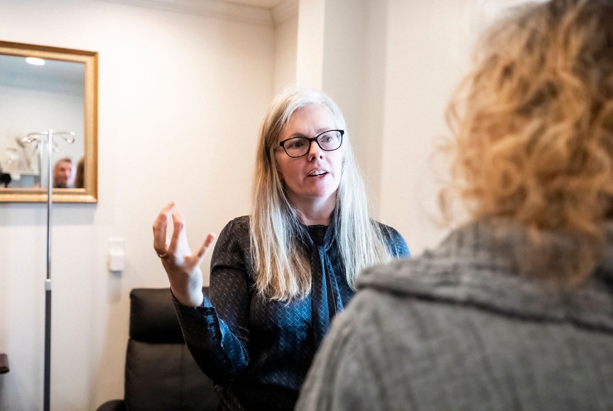 Dr. Andrea in warm consultation with a patient