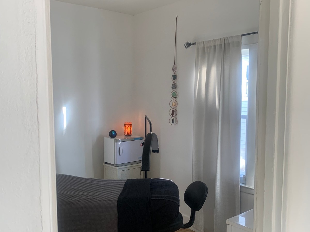 Warm, inviting holistic wellness treatment environment